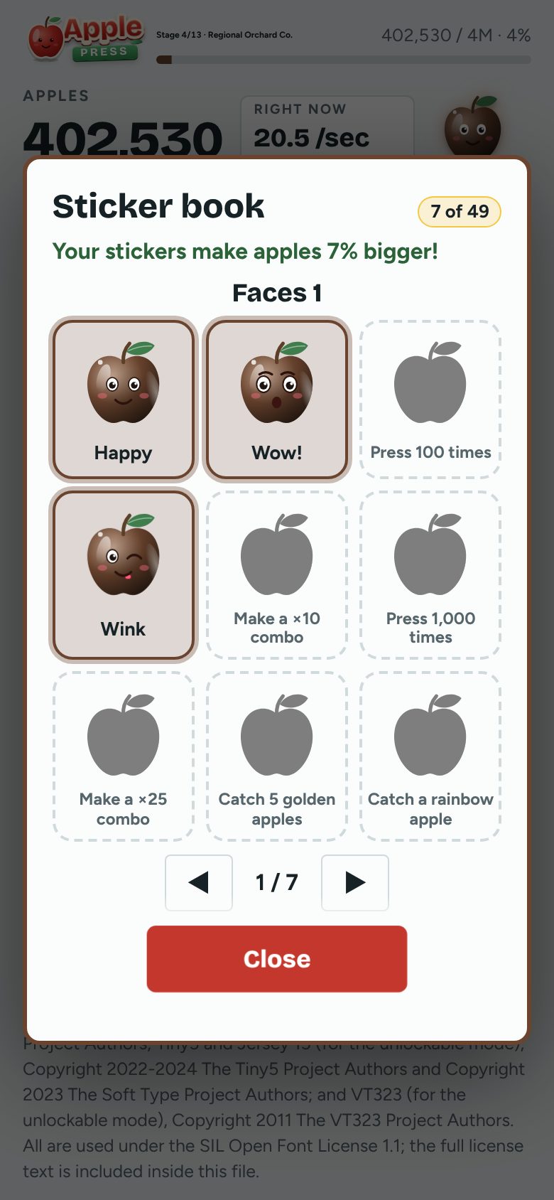 The sticker book on a phone, with apple faces to collect
